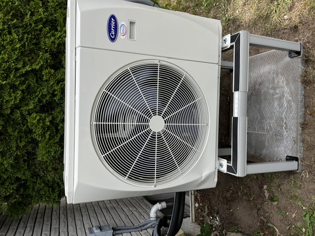 Carrier heat pump installed on a raised stand by Infiniti Air