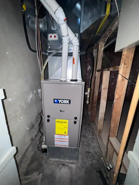 York furnace with connected ductwork and overhead vent piping